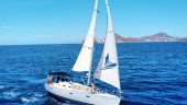 Sunset Sailboat Cruise with Papillon